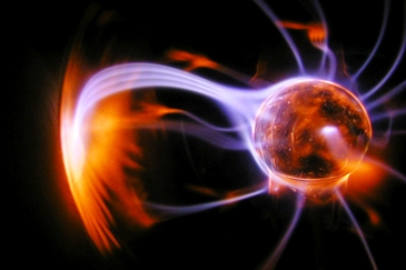 This photo of a plasma ball was taken by photographer Laurence Diver of Edinburgh, Scotland.  Plasma balls (or lamps) were first invented by physicist Nikola Tesla as a result of his experiments with high frequency currents in an evacuated glass tube (while studying high voltage phenomena).  Tesla called his first version an inert gas discharge tube.  The modern version (called plasma balls) is credited as having been designed by inventor Bill Parker while he was still a student at MIT in the 1970s.